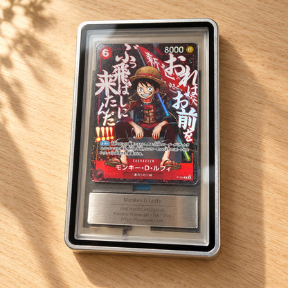 Gin (Silver) Hikari Display Case displaying a Monkey D. Luffy One Piece card on an oak table.